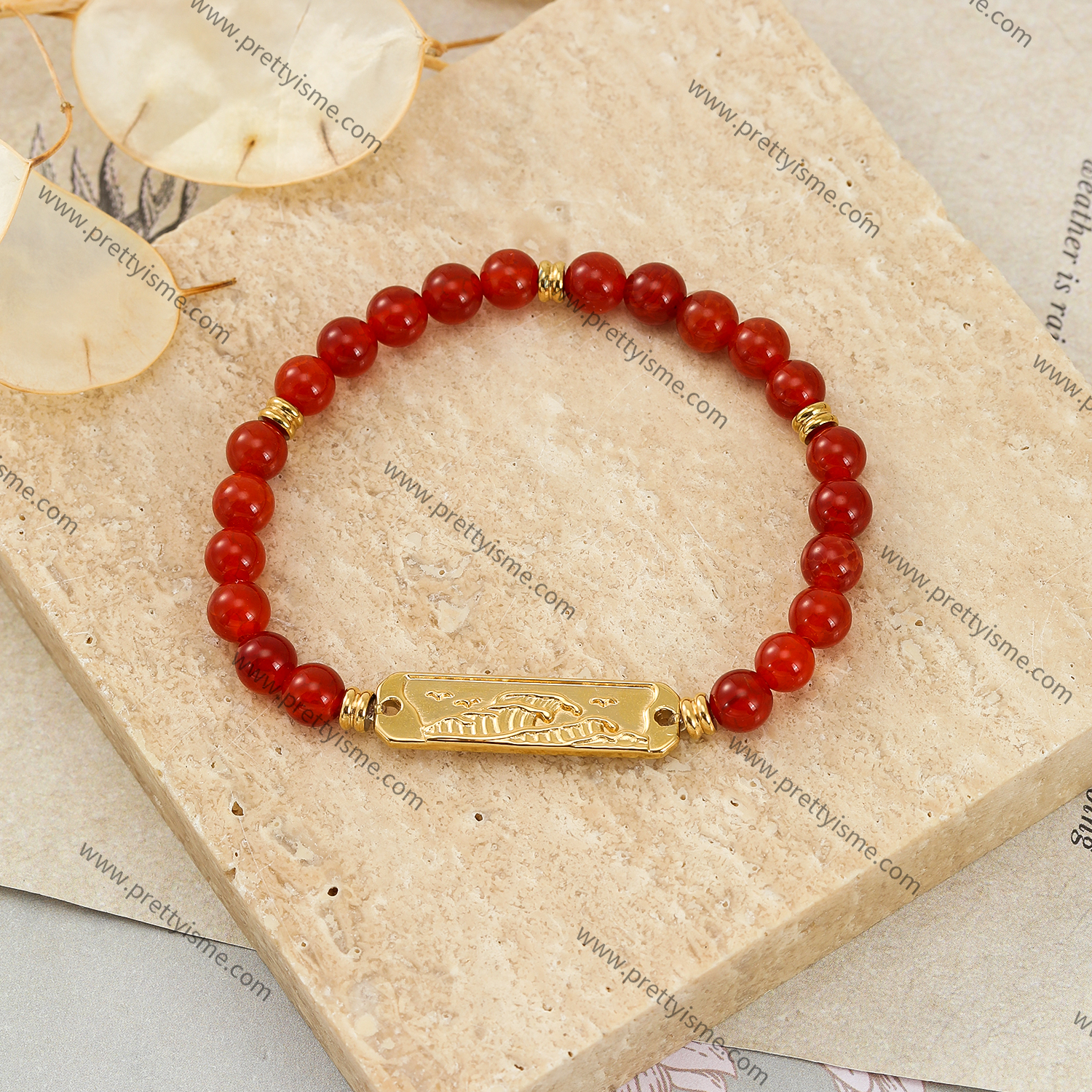 Red gemstone bracelet with stainless steel nugget engraving.webp
